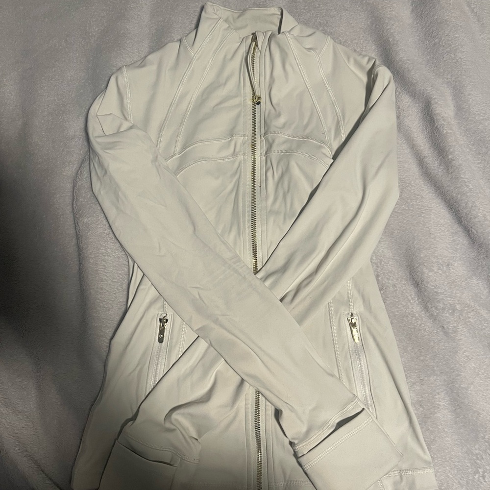 Lululemon brand new Define Jacket. Ivory with gold zipper size 4